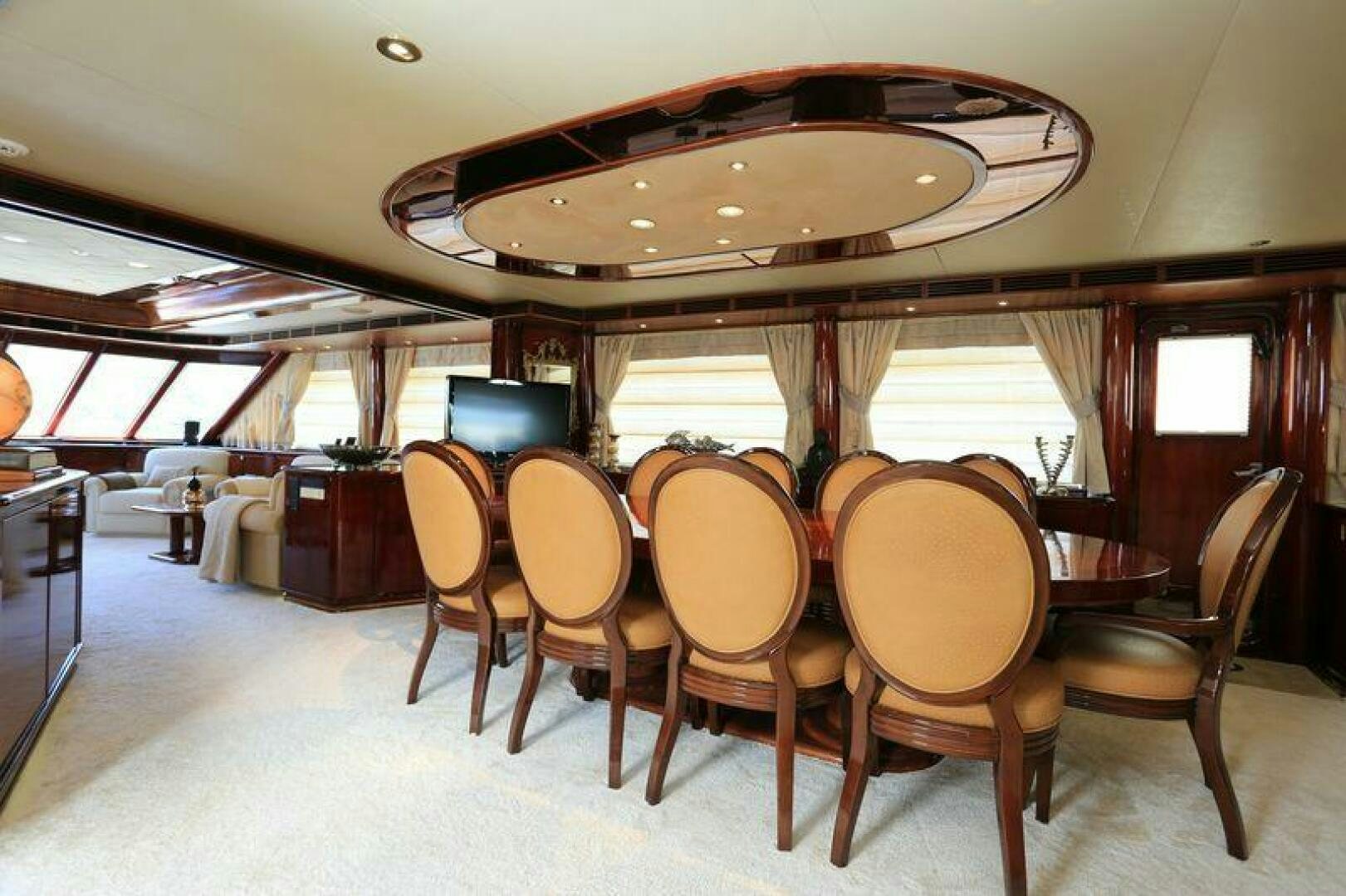 a large dining table with chairs aboard FORTY LOVE Yacht for Sale