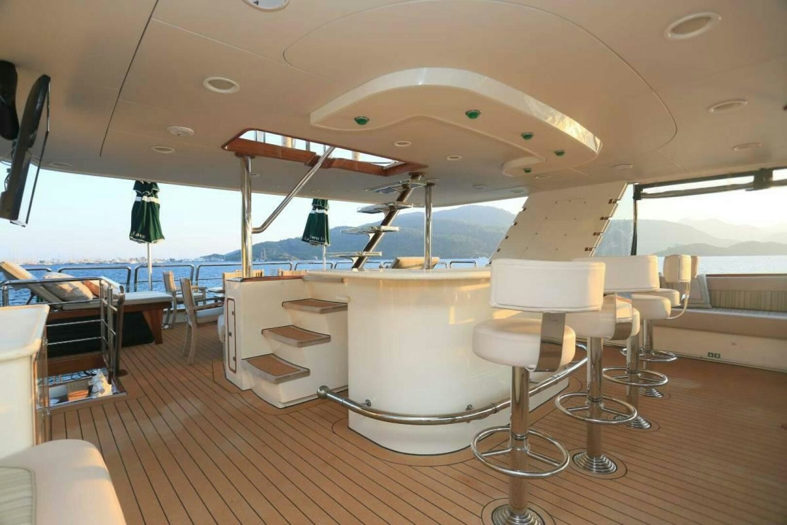 a room with tables and chairs aboard FORTY LOVE Yacht for Sale