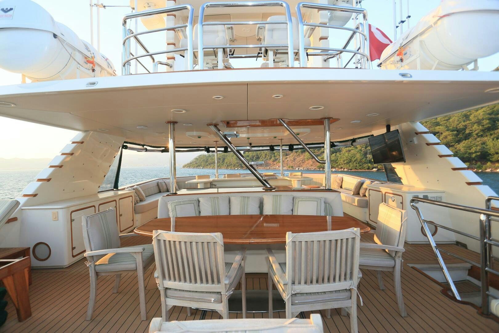 a boat with chairs and tables aboard FORTY LOVE Yacht for Sale