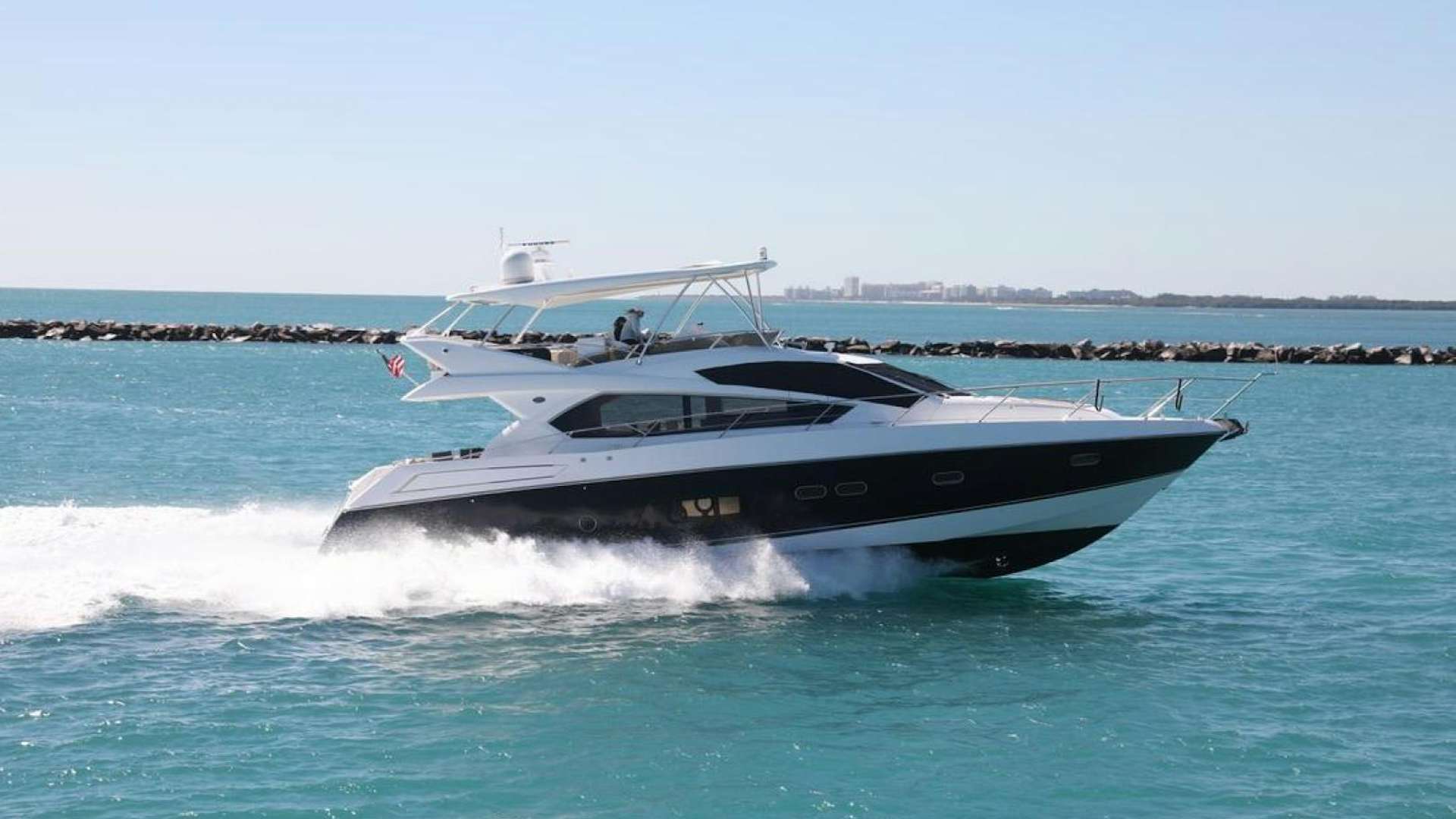 a boat on the water aboard THE LOAN SHARK Yacht for Sale