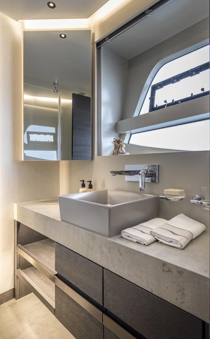 a bathroom with a large mirror aboard 26XP HULL 24 Yacht for Sale