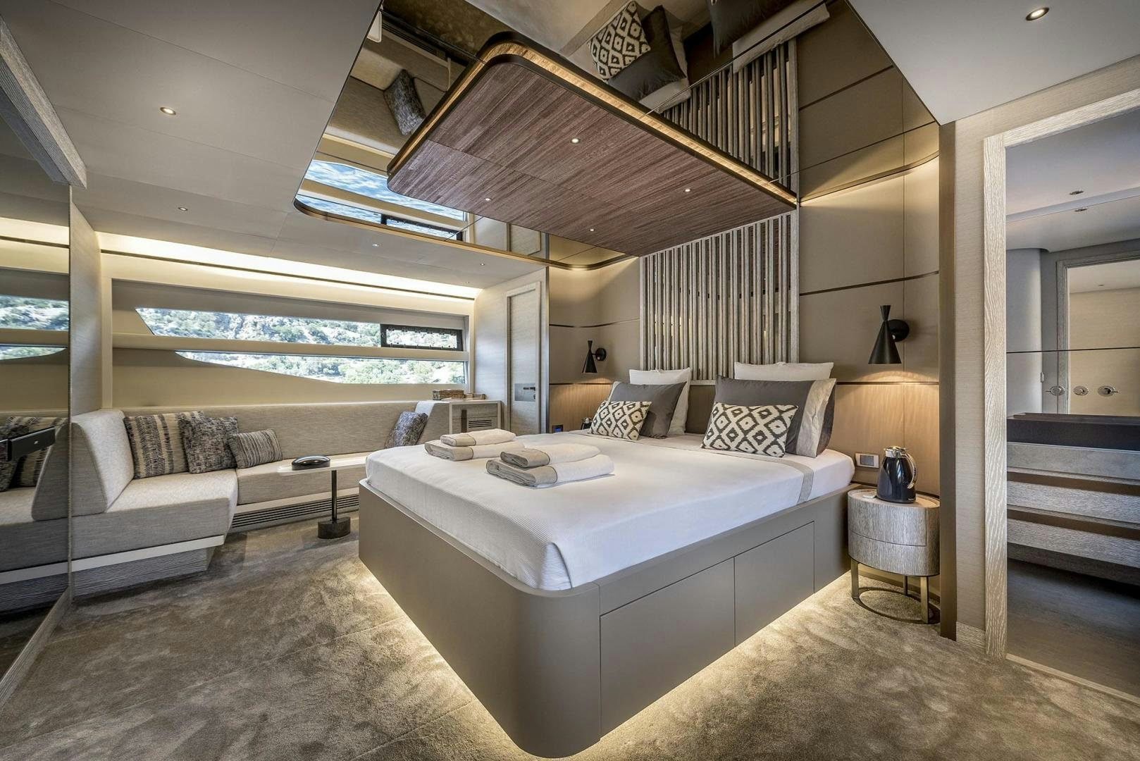 a room with a bed and a couch aboard 26XP HULL 24 Yacht for Sale