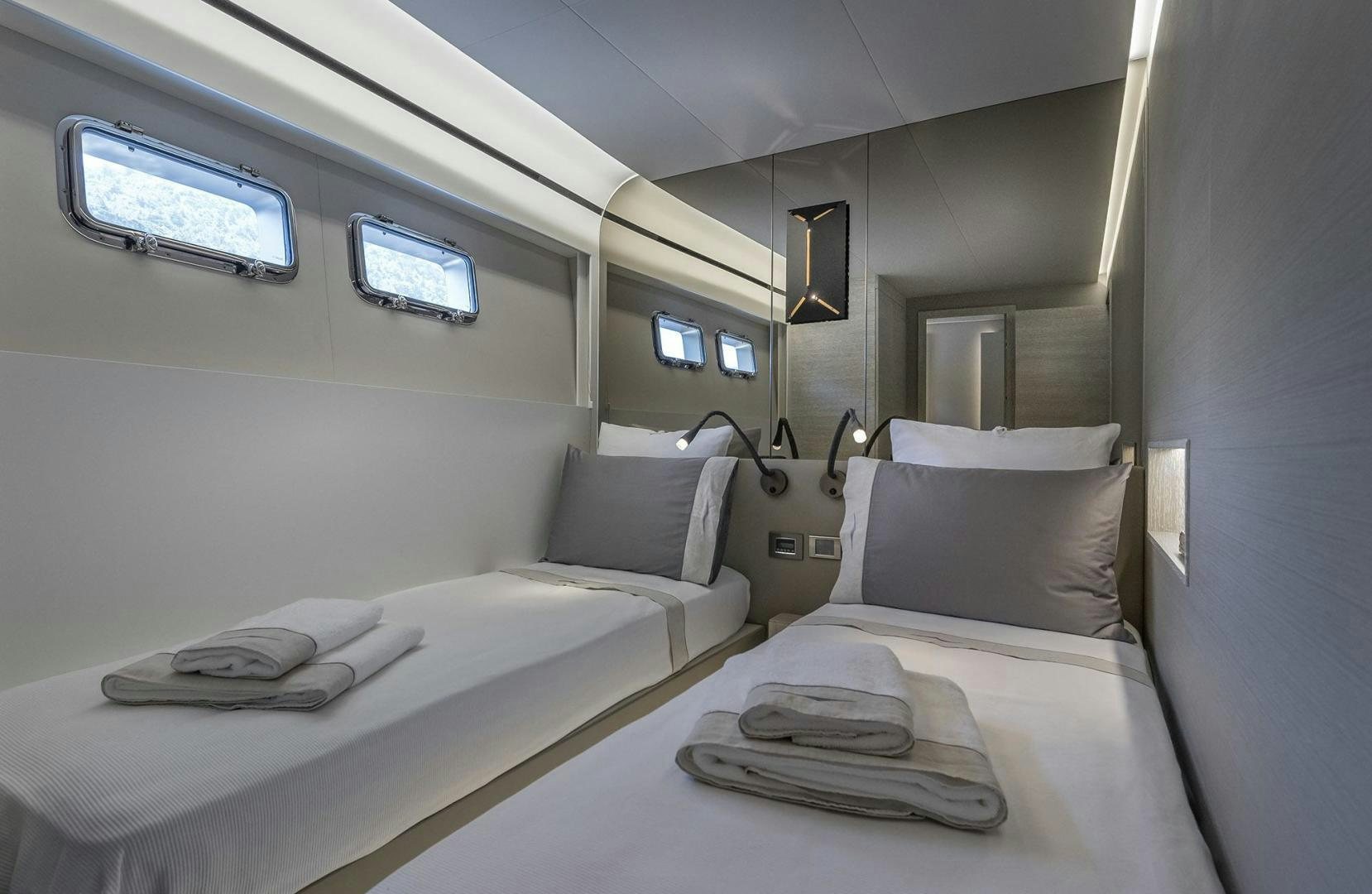 a room with beds and a window aboard 26XP HULL 24 Yacht for Sale