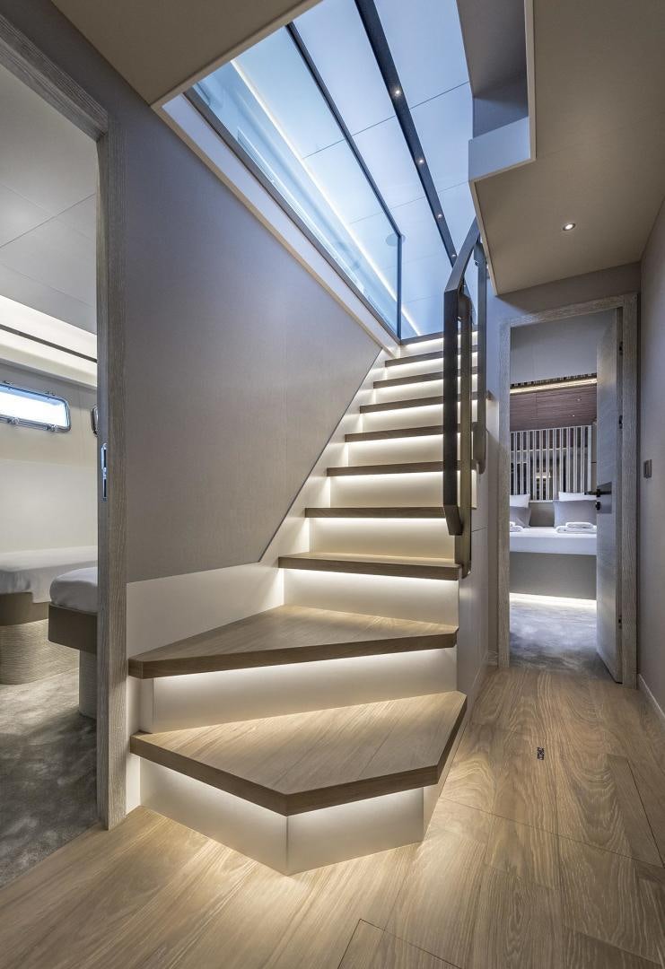 a staircase with a glass window aboard 26XP HULL 24 Yacht for Sale