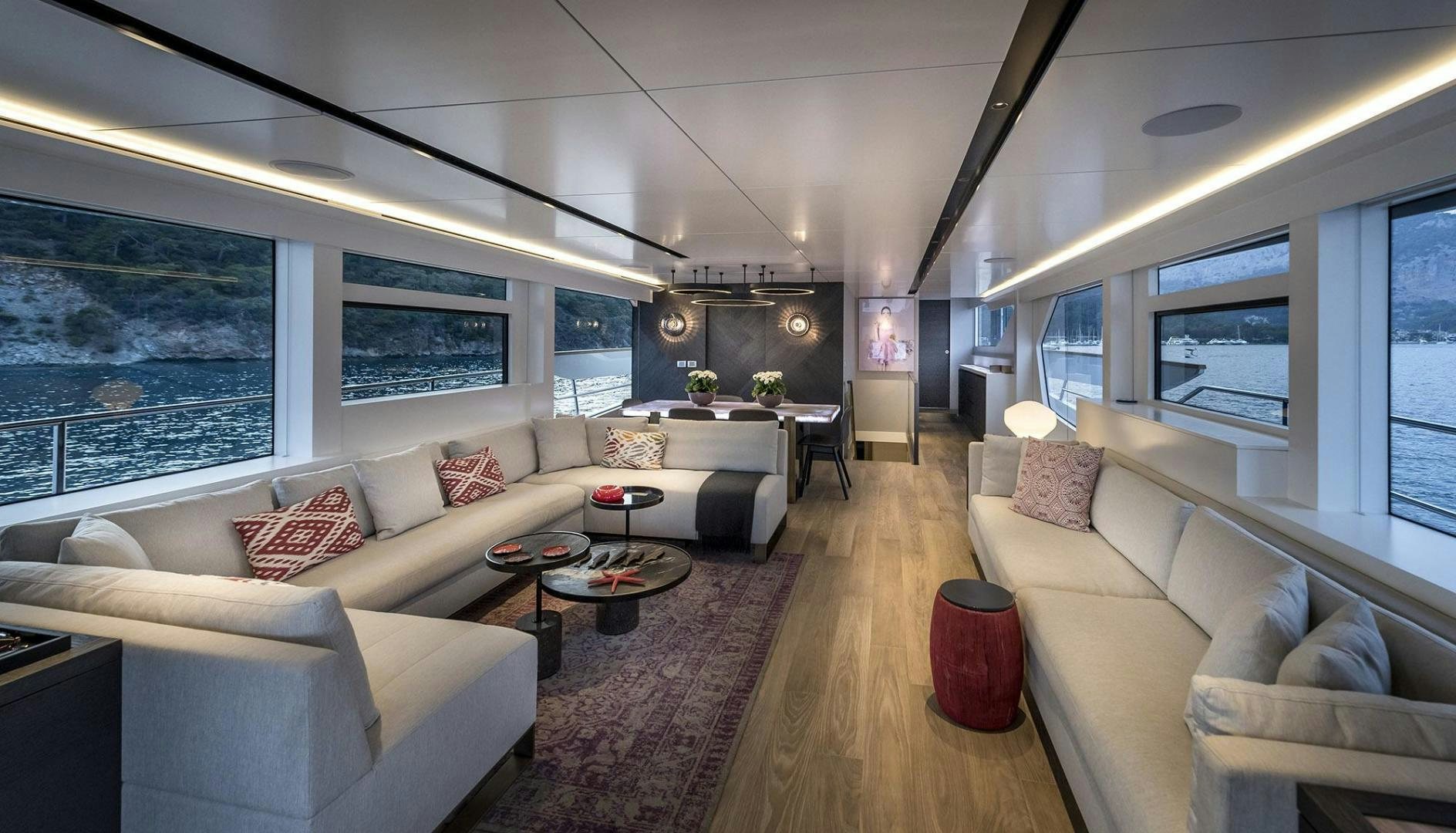 a living room with a large window aboard 26XP HULL 24 Yacht for Sale