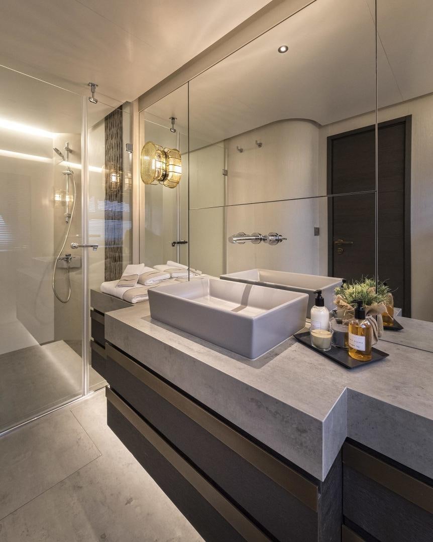 a bathroom with a large bathtub aboard 26XP HULL 24 Yacht for Sale