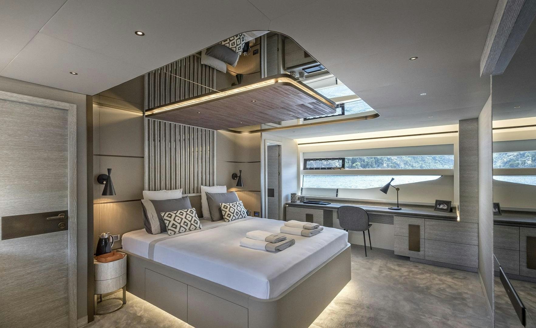 a large bedroom with a large balcony aboard 26XP HULL 24 Yacht for Sale
