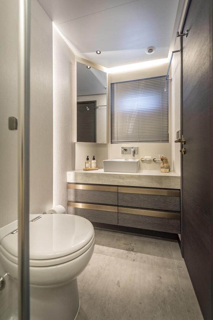 a bathroom with a sink and a toilet aboard 26XP HULL 24 Yacht for Sale
