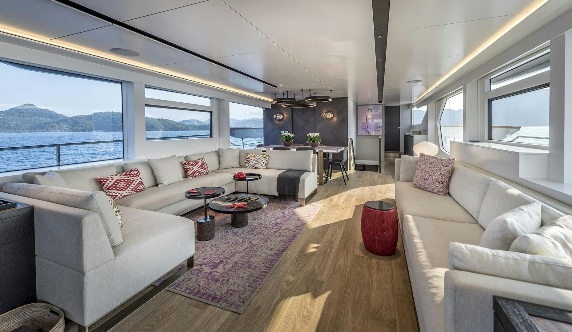a living room with a large window aboard 26XP HULL 24 Yacht for Sale