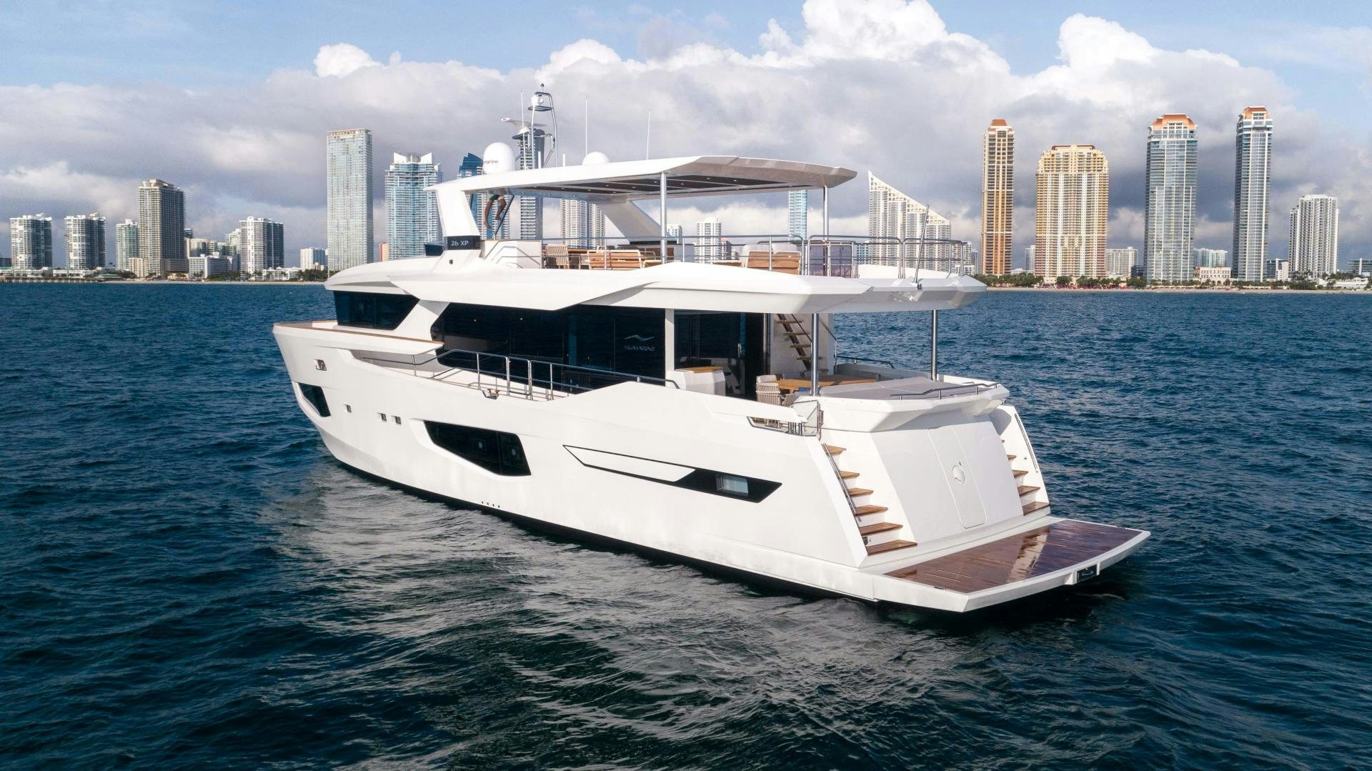a white yacht in the water aboard C3 Yacht for Sale