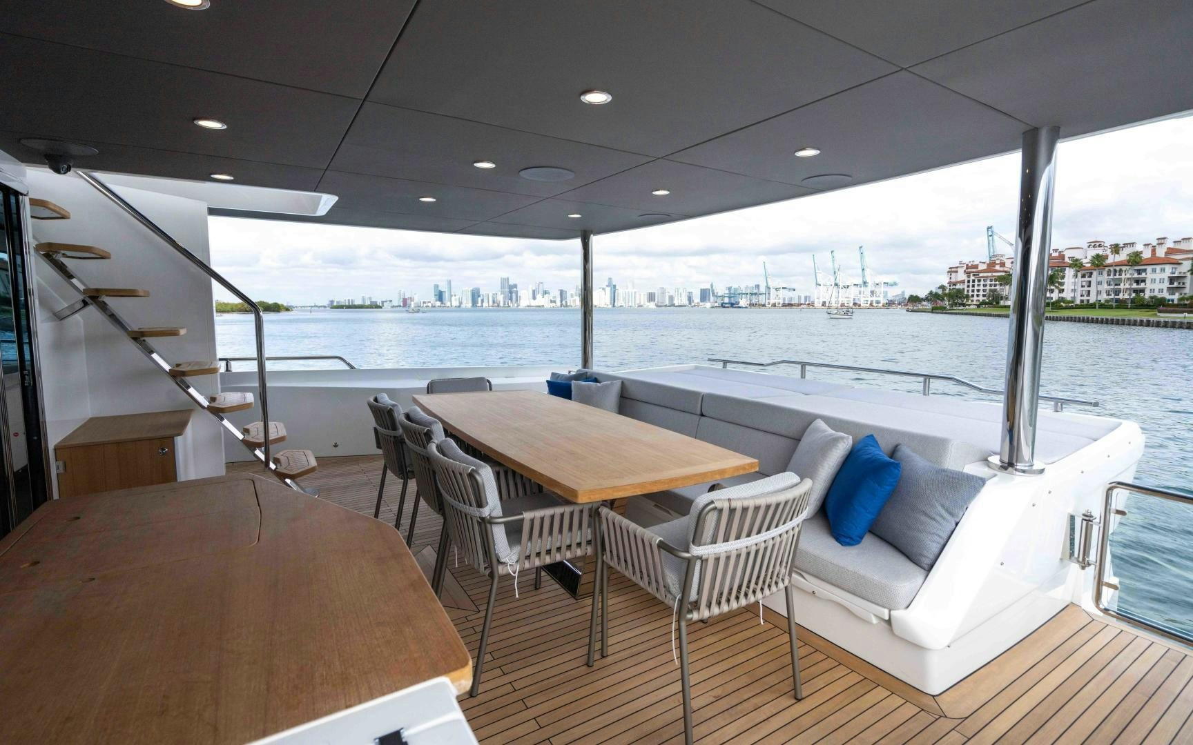 a room with a table and chairs aboard C3 Yacht for Sale