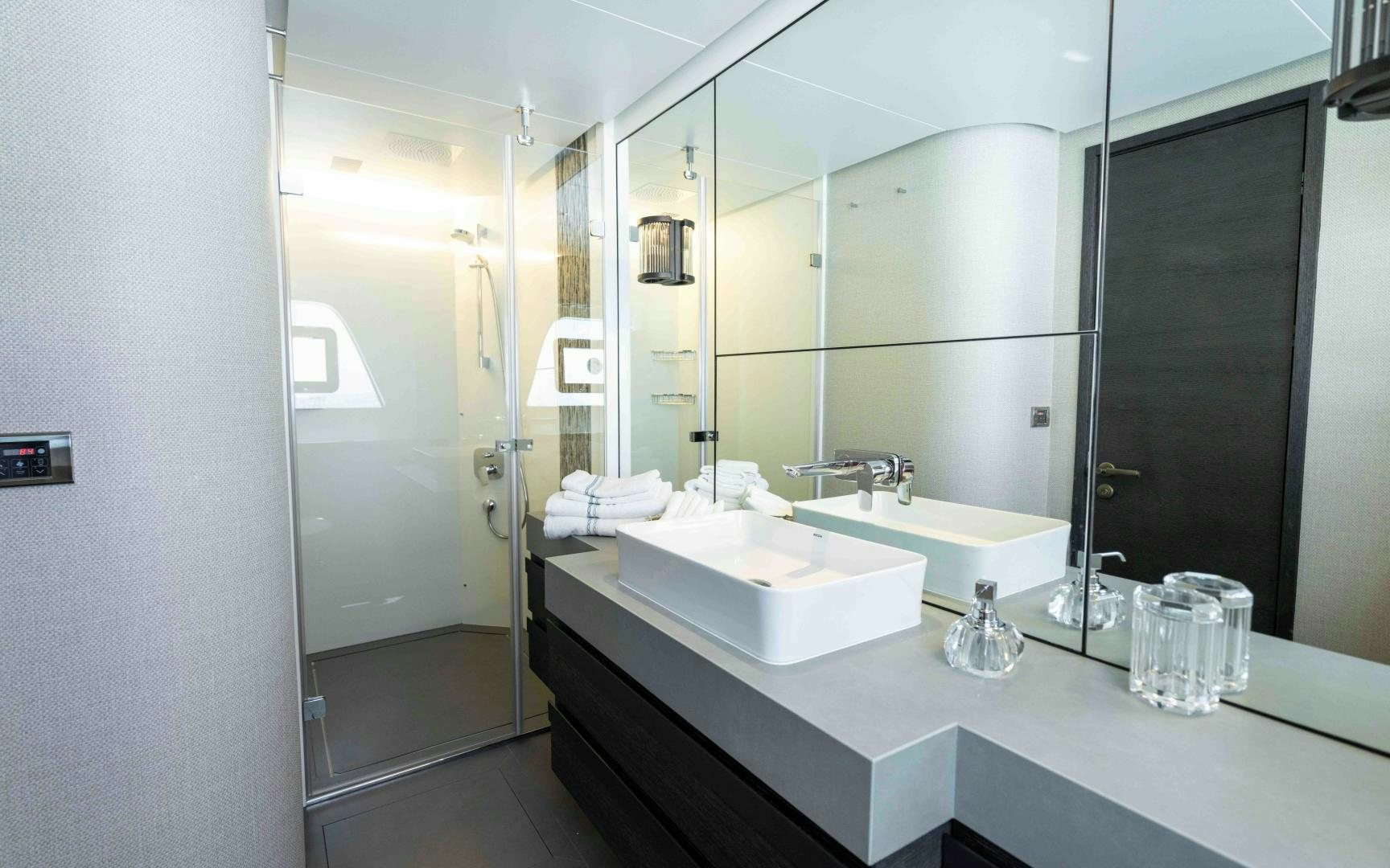 a bathroom with a large mirror aboard C3 Yacht for Sale
