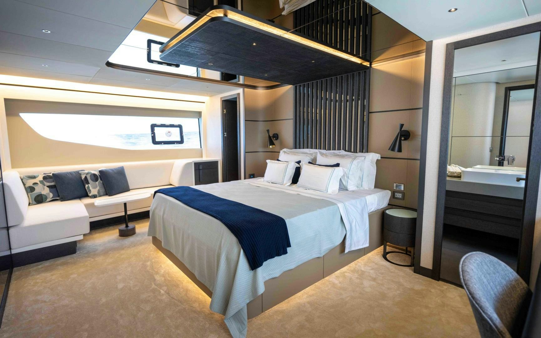 a room with a bed and a couch aboard C3 Yacht for Sale