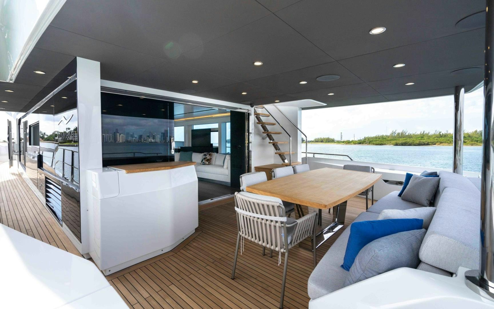 a living room with a large window aboard C3 Yacht for Sale