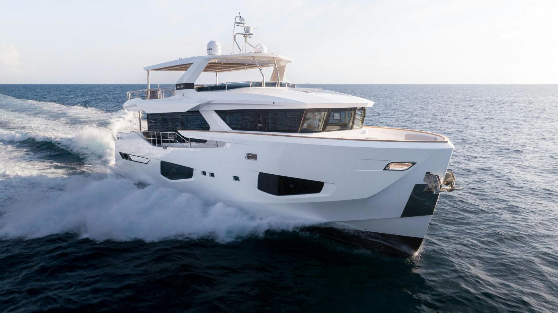 a white boat on the water aboard C3 Yacht for Sale
