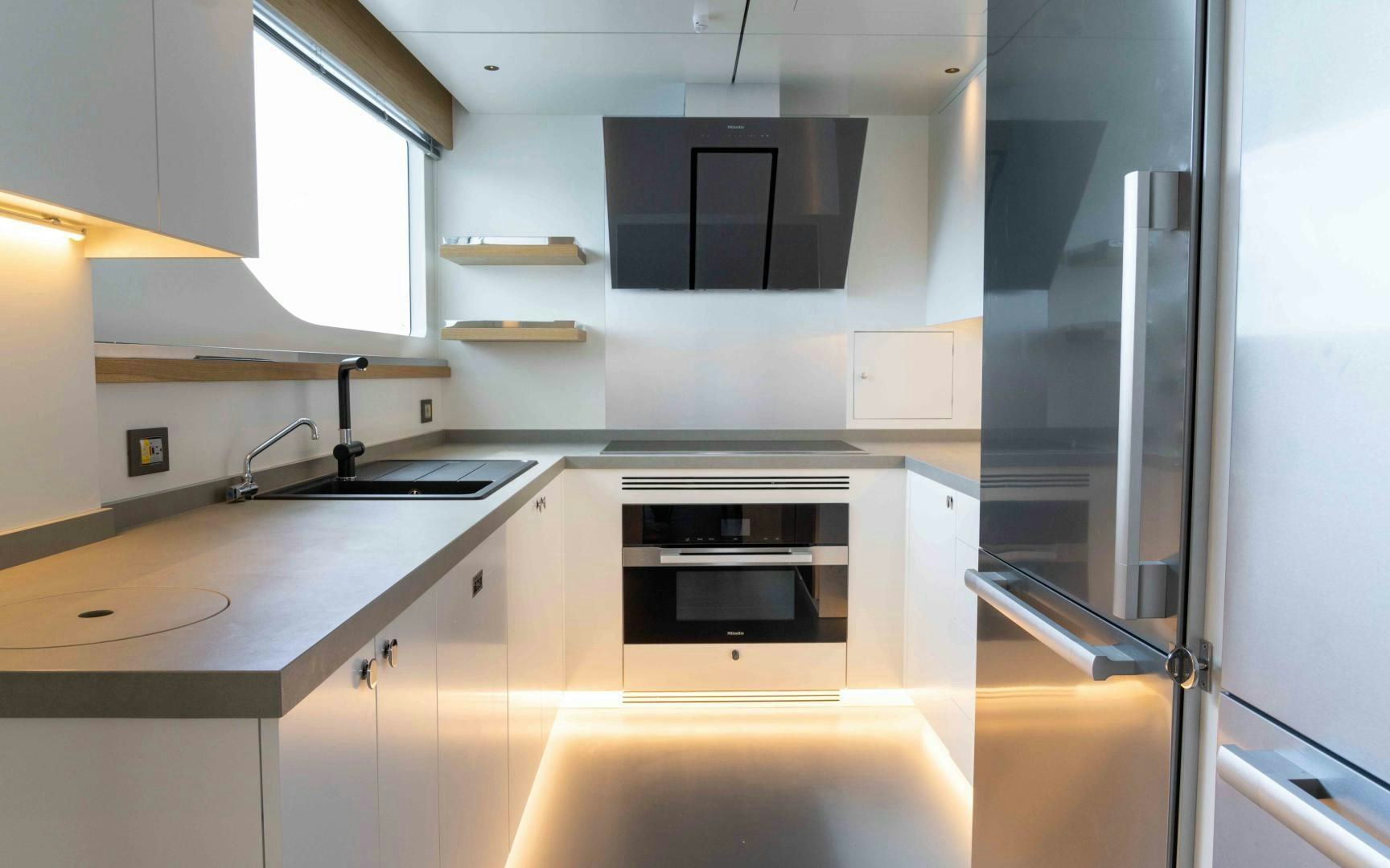 a kitchen with a stainless steel stove aboard C3 Yacht for Sale