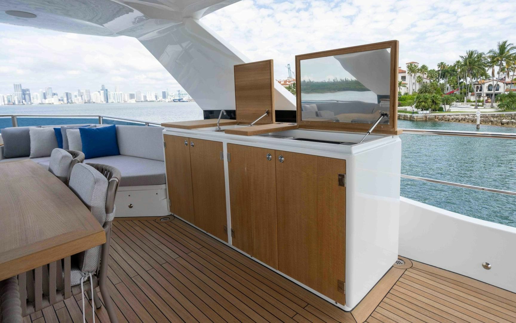 a room with a bed and a television on the wall aboard C3 Yacht for Sale