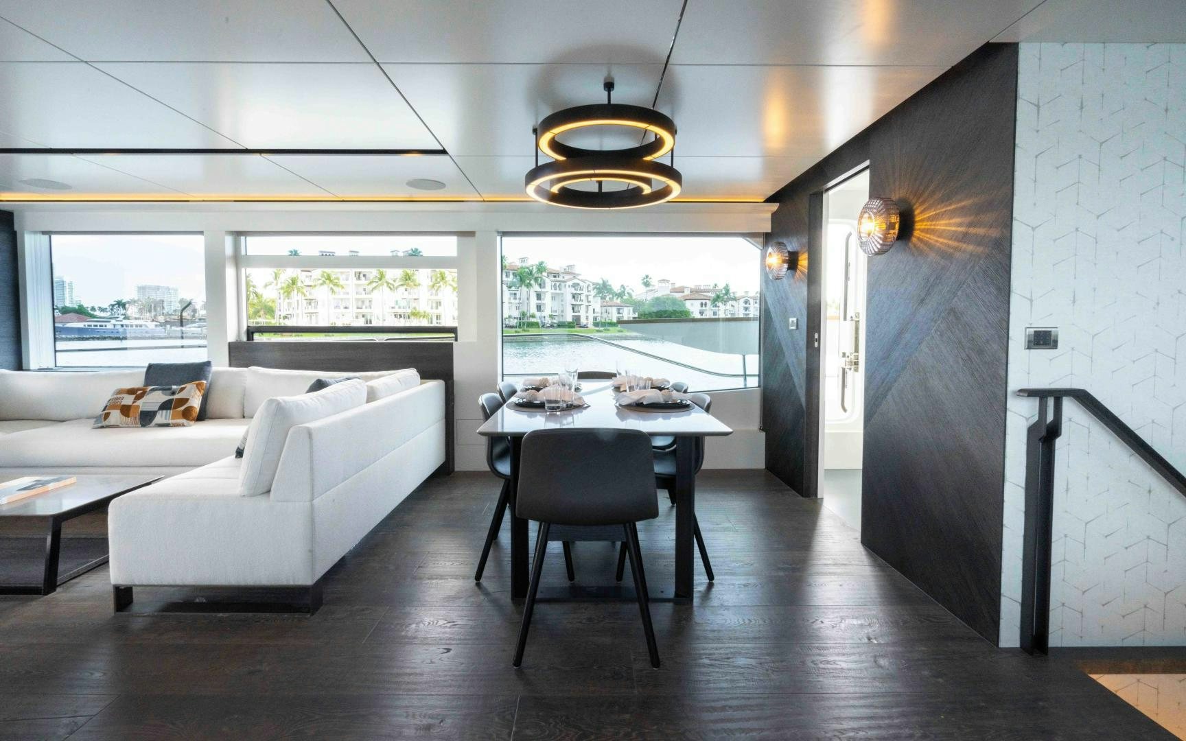 a room with a couch and a table and a large window aboard C3 Yacht for Sale