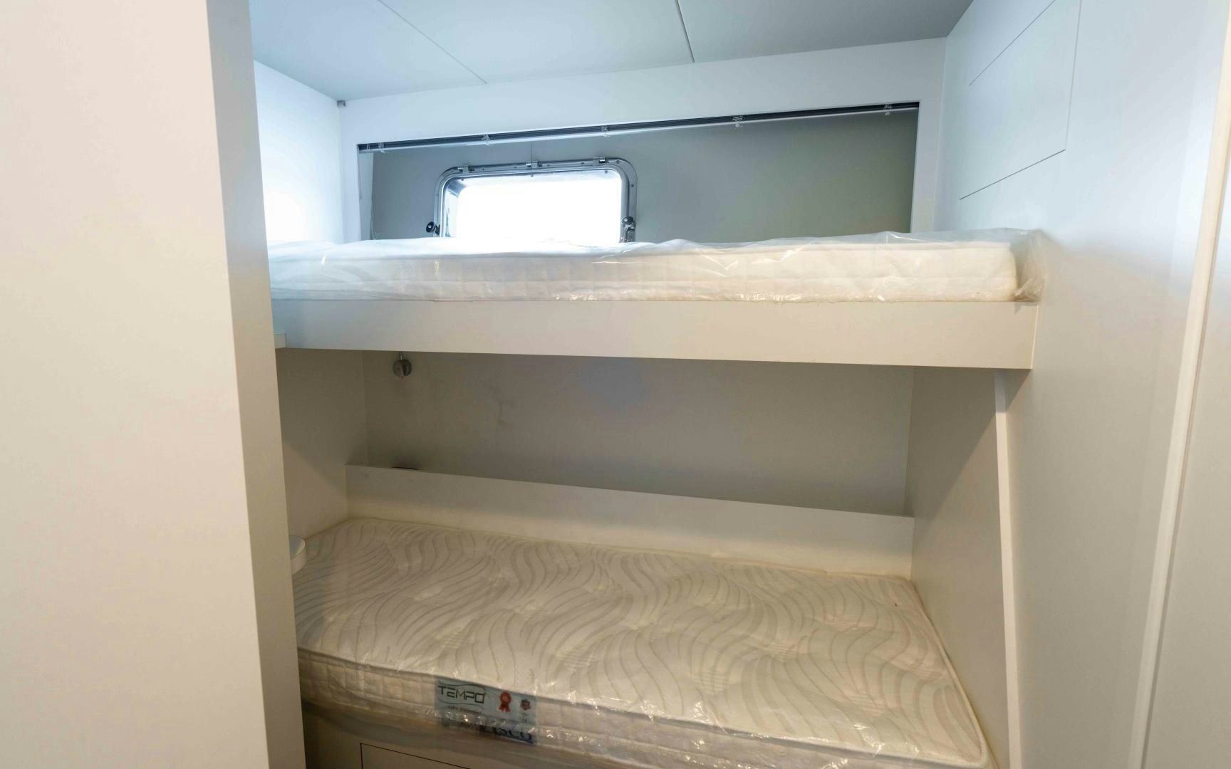 a closet with a bed aboard C3 Yacht for Sale