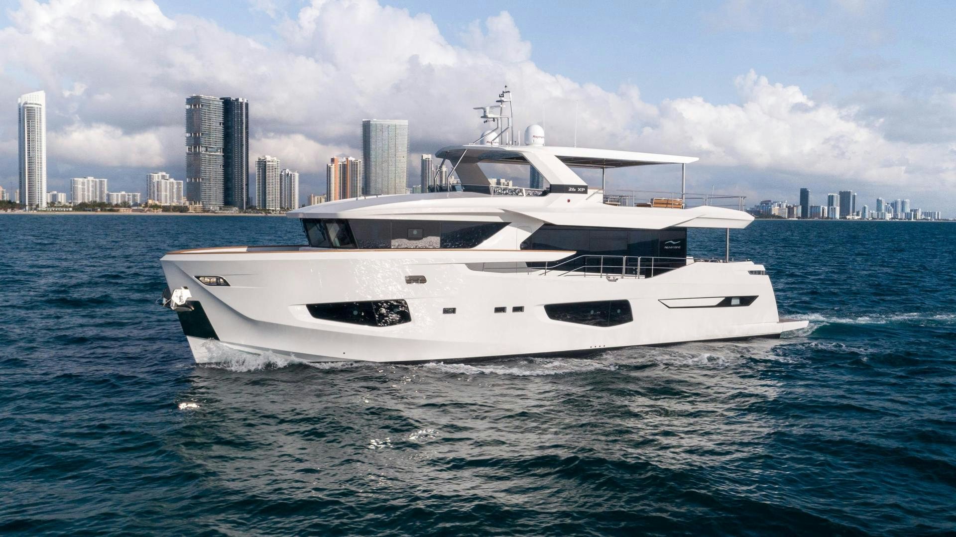 a white yacht in the water aboard C3 Yacht for Sale