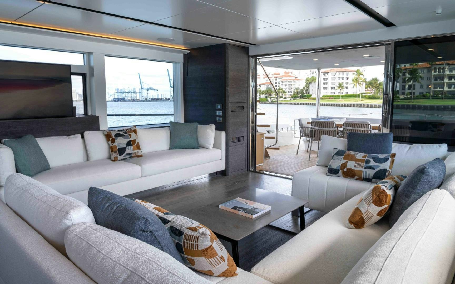 a living room with a large window aboard C3 Yacht for Sale