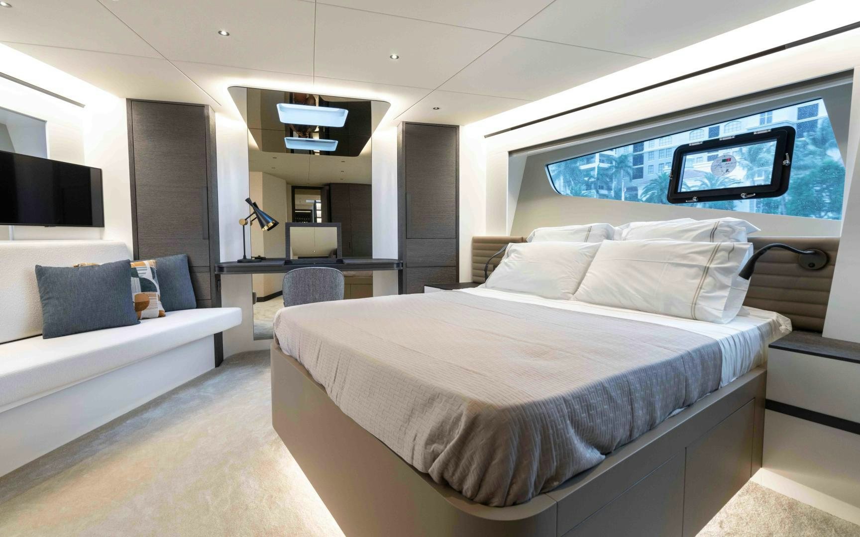 a room with a bed and a couch aboard C3 Yacht for Sale