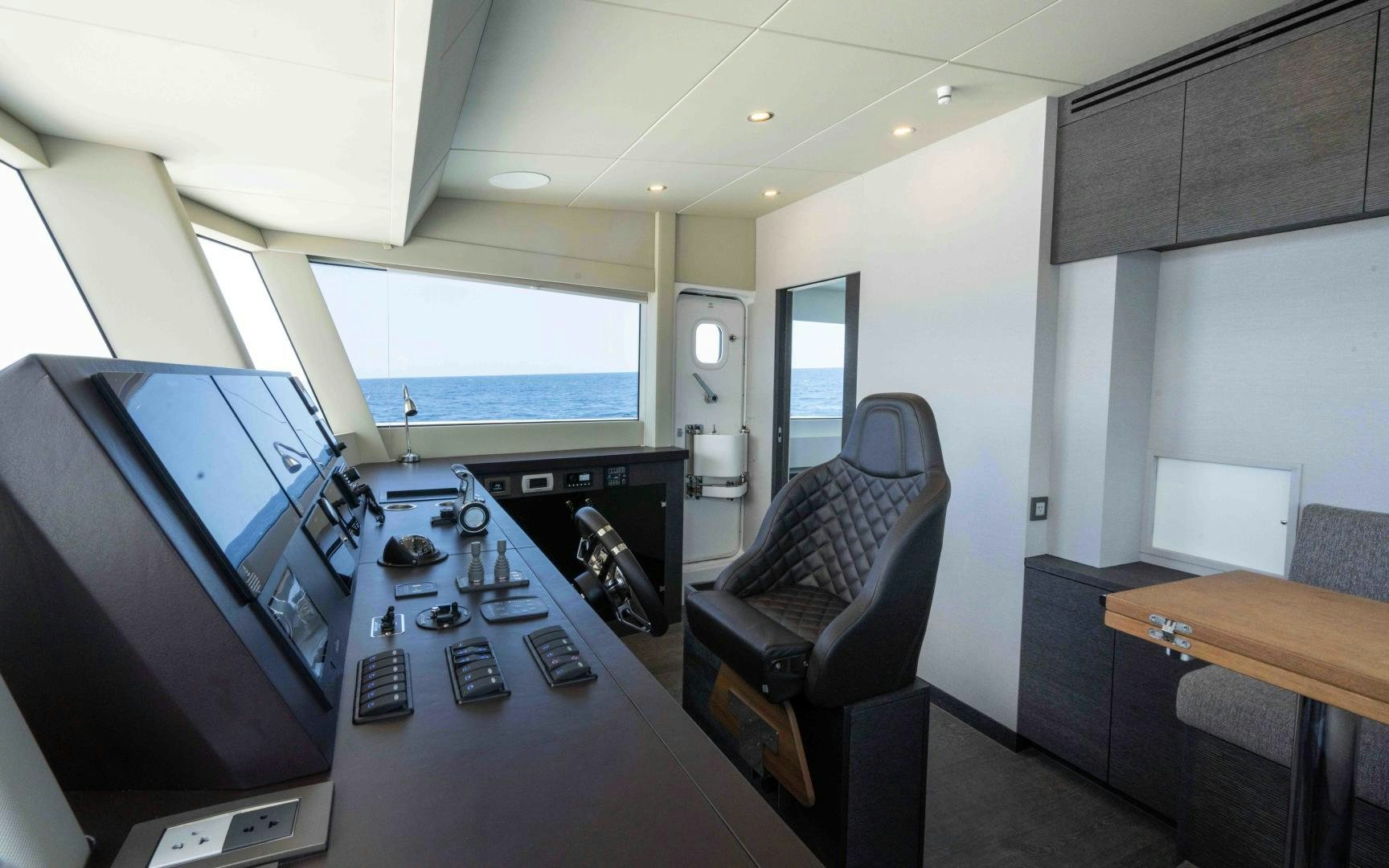 a room with a desk and computer aboard C3 Yacht for Sale