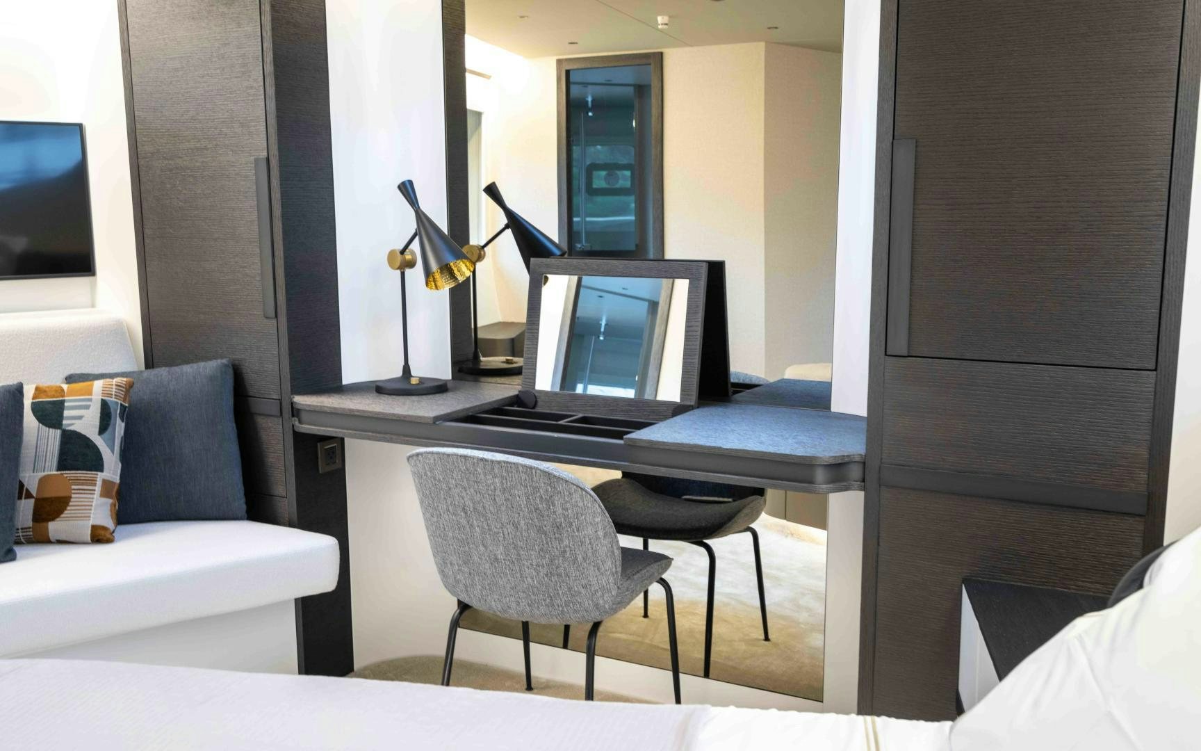 a room with a laptop and a chair aboard C3 Yacht for Sale