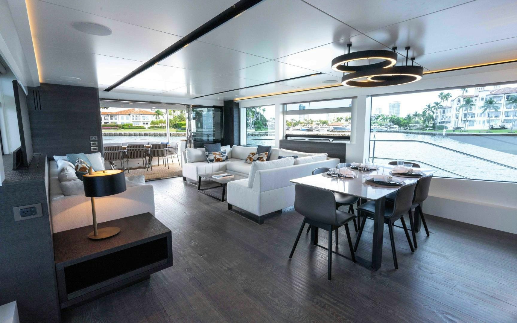 a living room with a large window aboard C3 Yacht for Sale