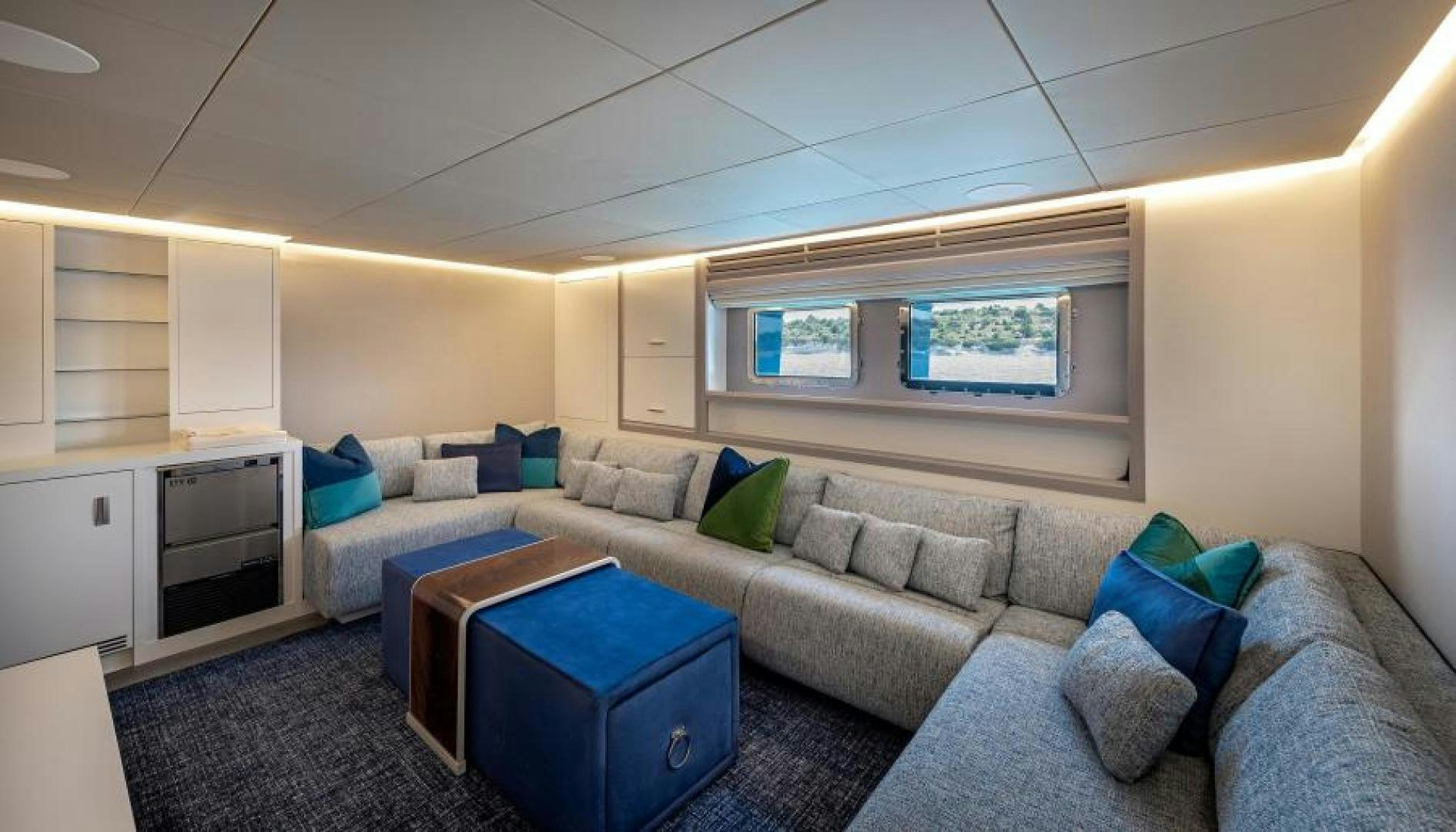 a living room with a couch and a table aboard NUMARINE 37XP 17 Yacht for Sale