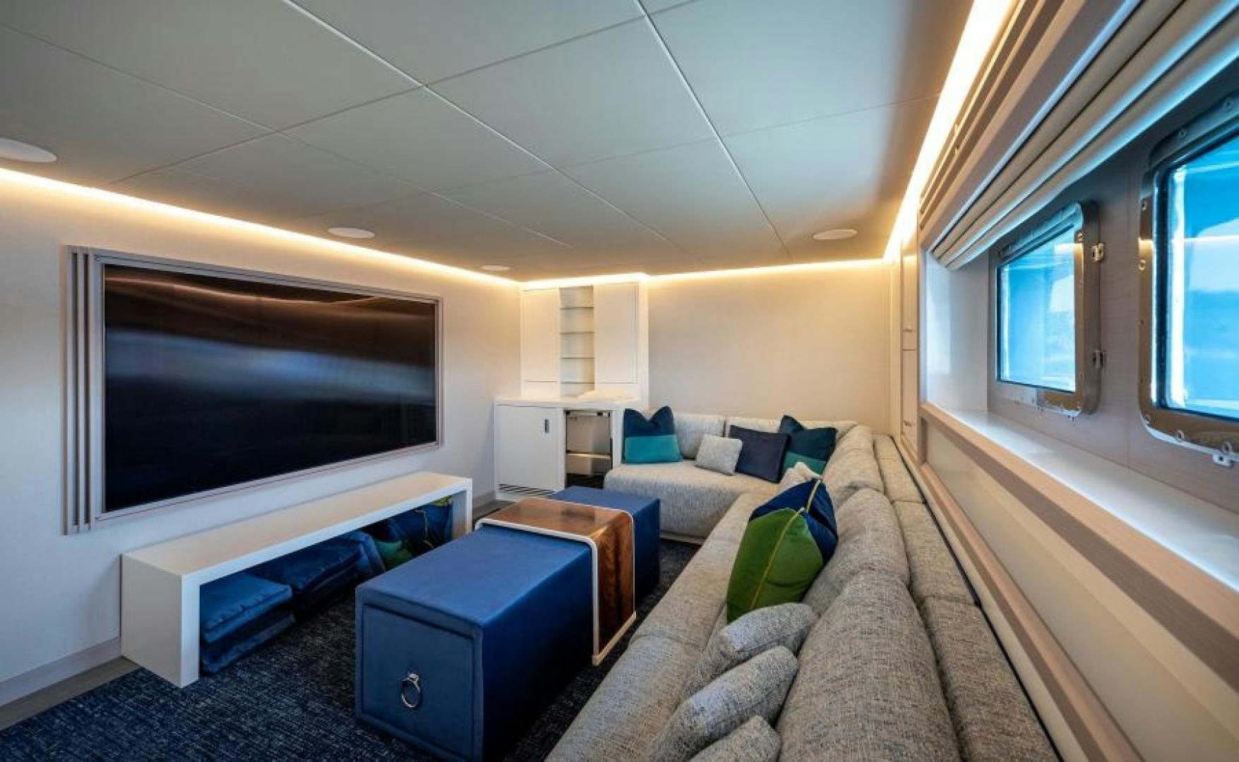 a living room with a large television aboard NUMARINE 37XP 17 Yacht for Sale
