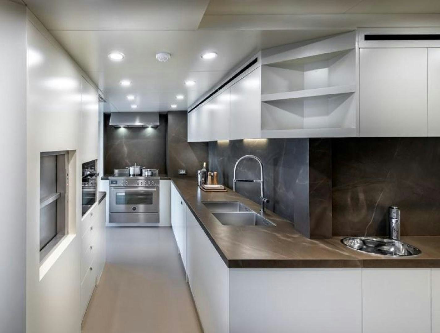 a kitchen with white cabinets aboard NUMARINE 37XP 17 Yacht for Sale
