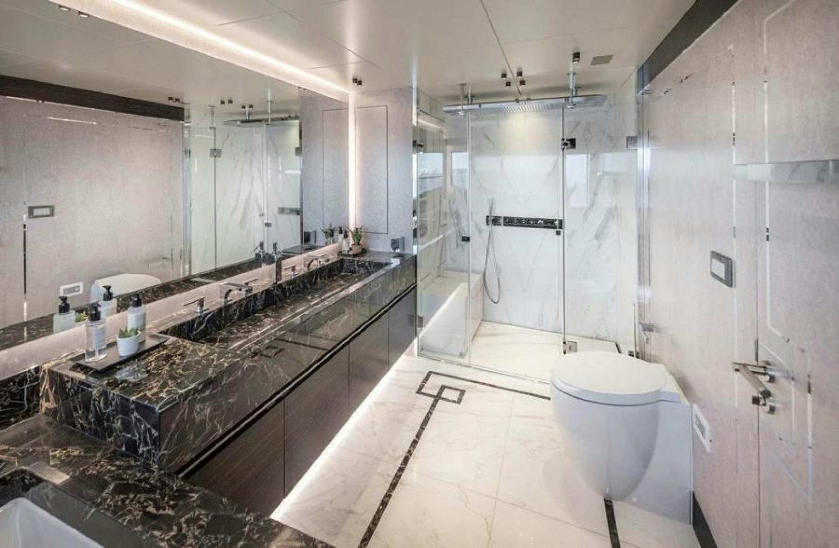 a bathroom with a large mirror aboard NUMARINE 37XP 17 Yacht for Sale