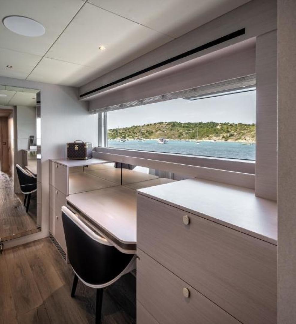 a room with a window and a desk aboard NUMARINE 37XP 17 Yacht for Sale