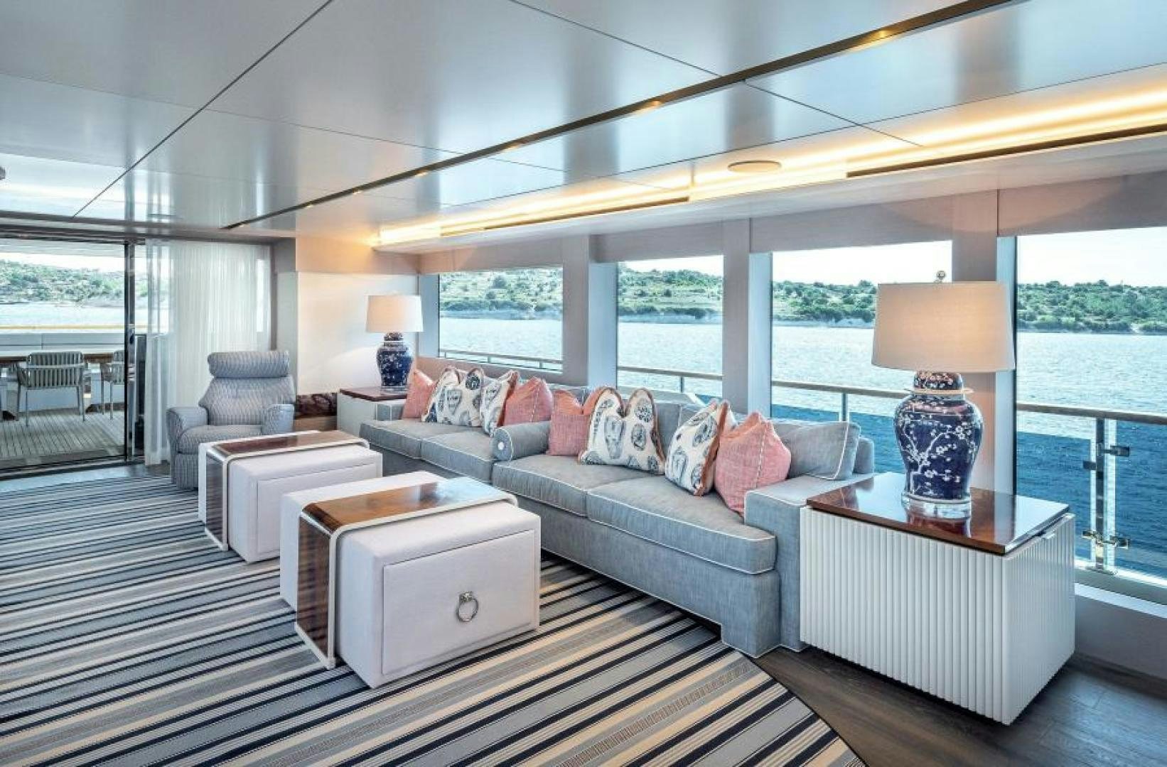 a living room with a large window aboard NUMARINE 37XP 17 Yacht for Sale