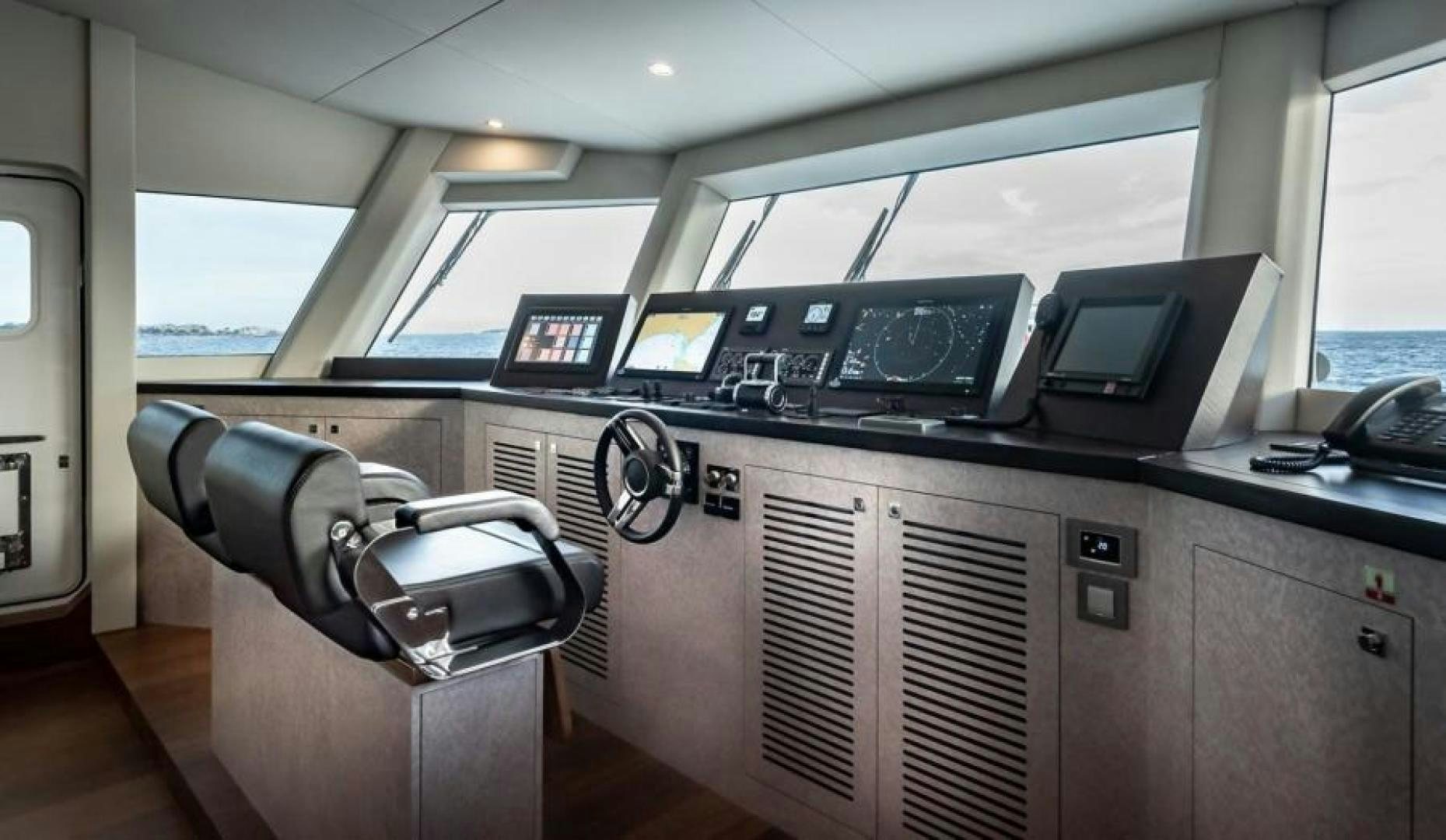 a car with a large screen aboard NUMARINE 37XP 17 Yacht for Sale