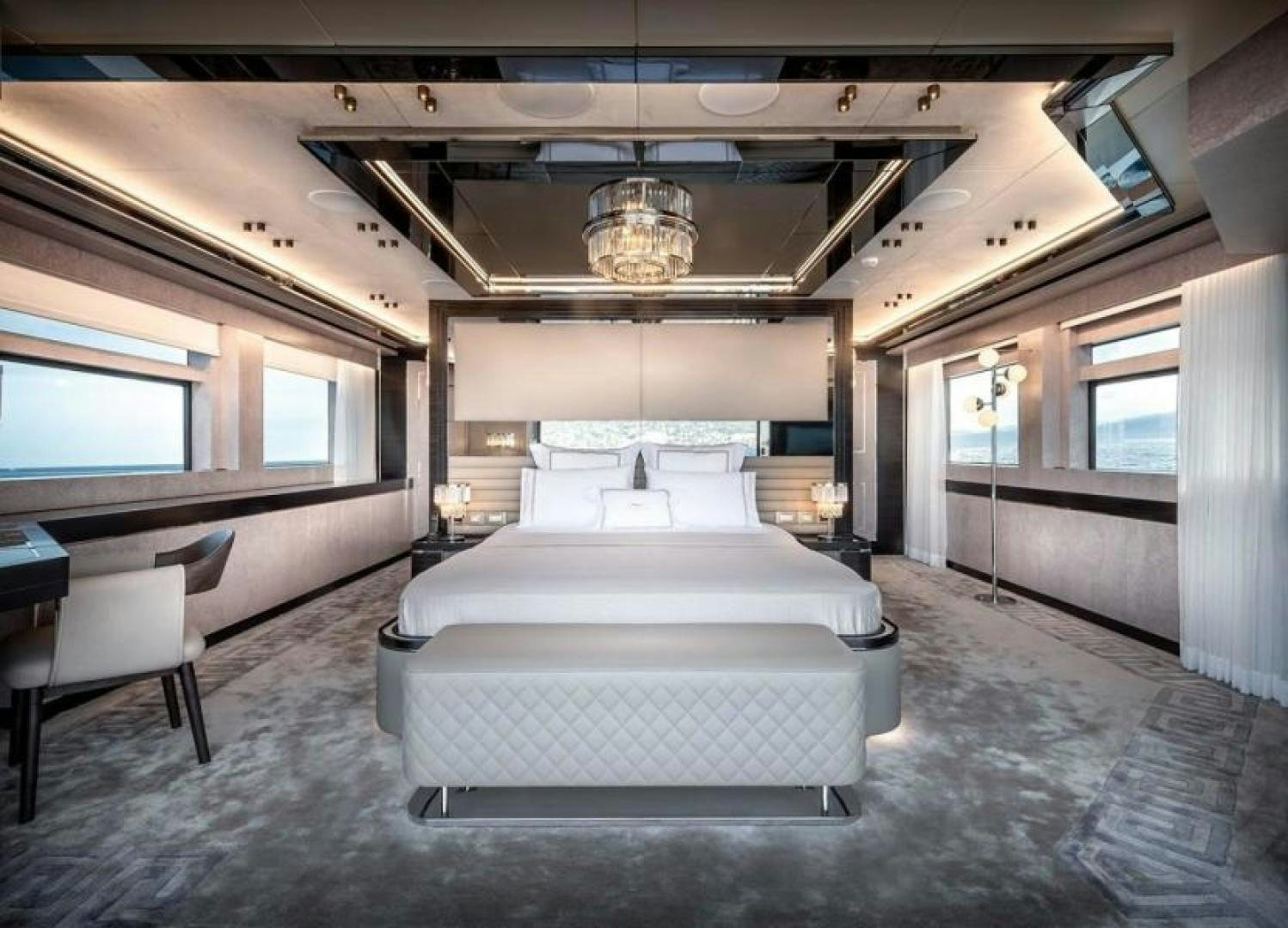 a room with a bed and a chair aboard NUMARINE 37XP 17 Yacht for Sale