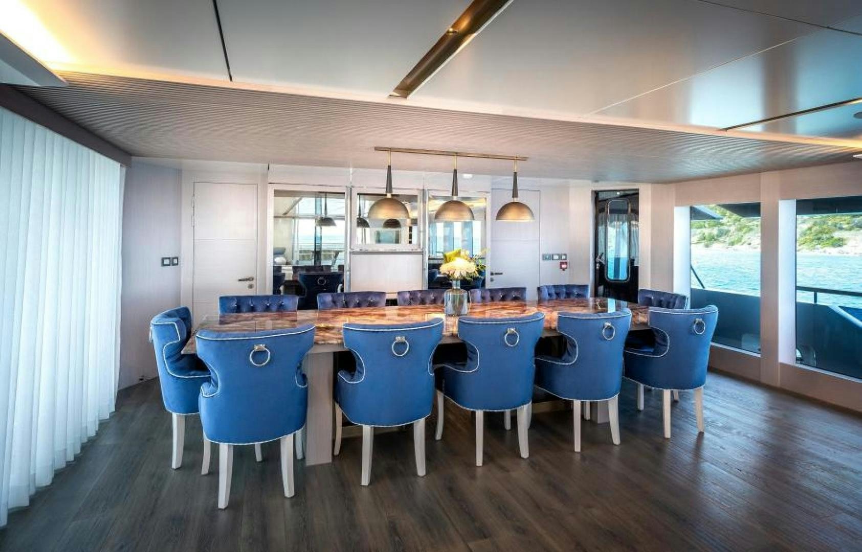 a large kitchen with a table and chairs aboard NUMARINE 37XP 17 Yacht for Sale