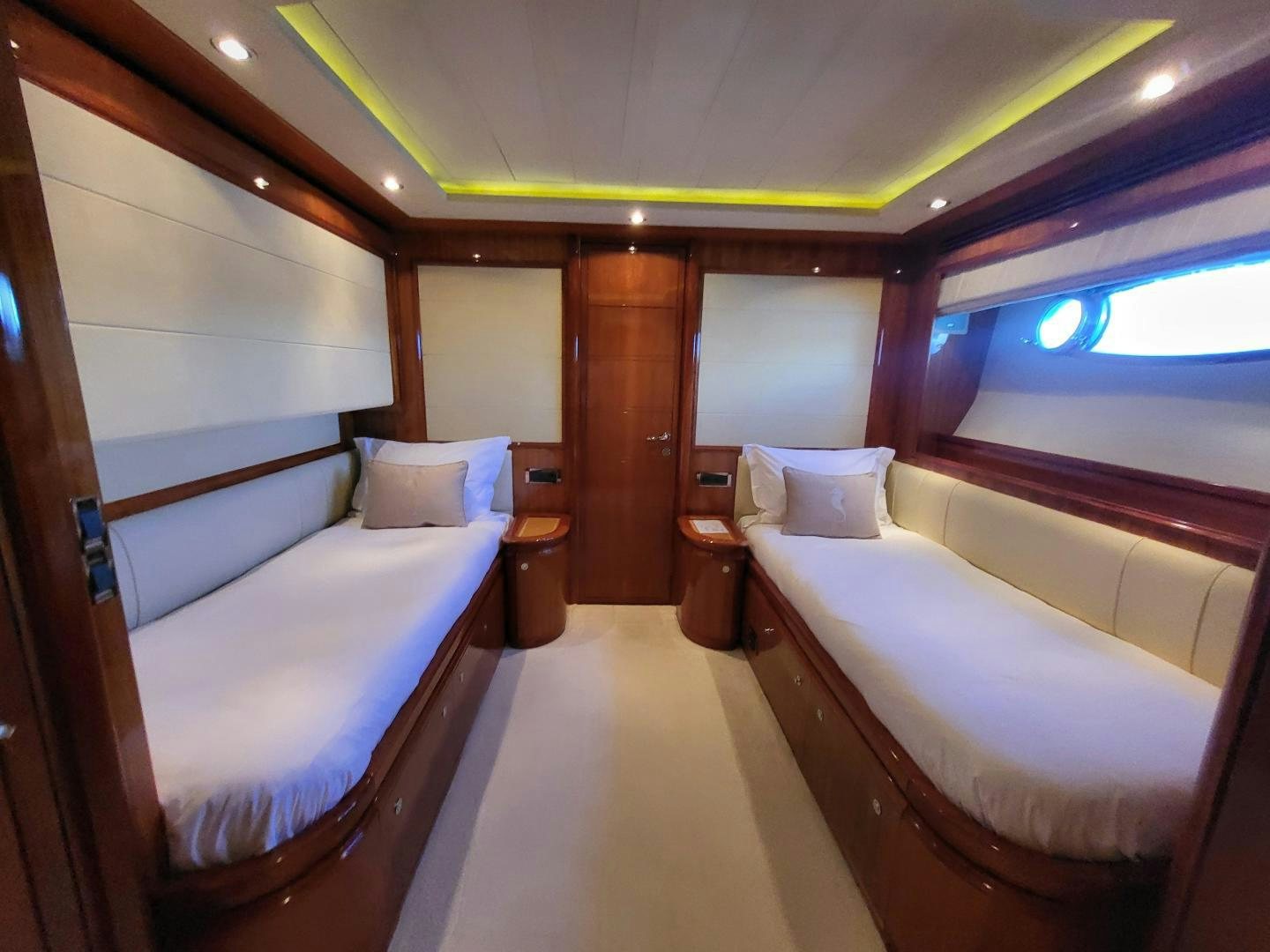 a room with two beds aboard CHAMPAGNE & CAVIAR Yacht for Sale