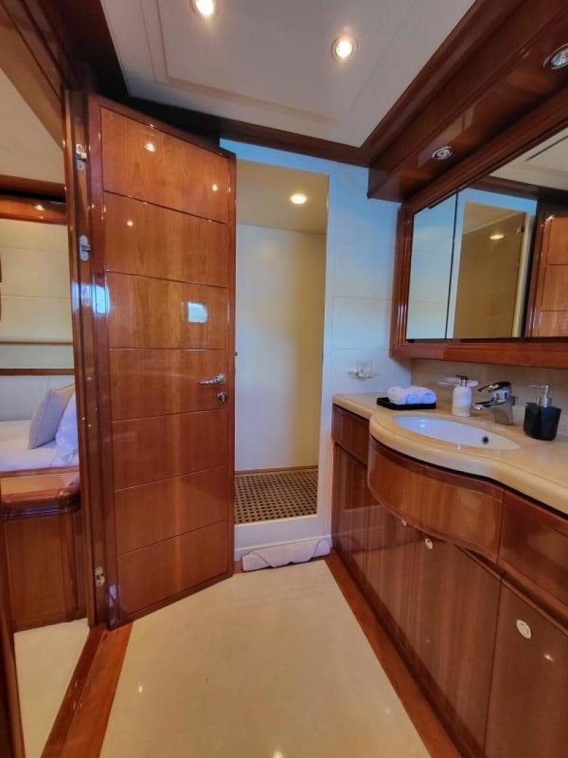a bathroom with a wood cabinet aboard CHAMPAGNE & CAVIAR Yacht for Sale