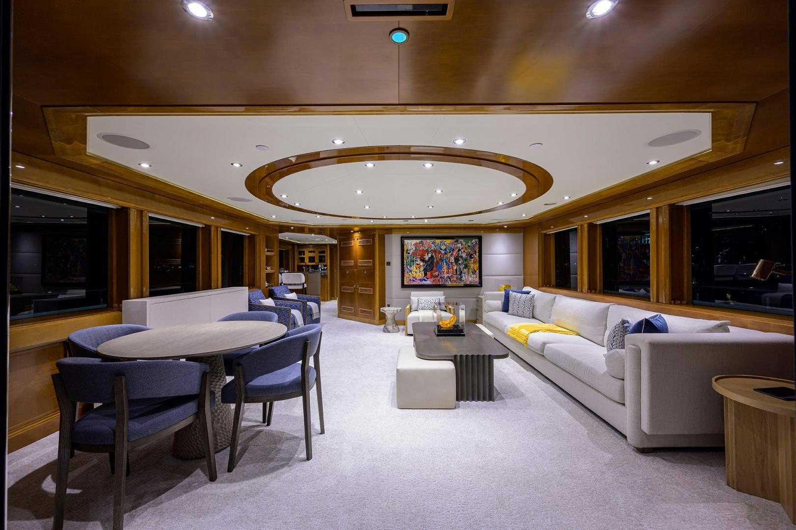 a large living room with a large chandelier aboard SEANASH Yacht for Sale