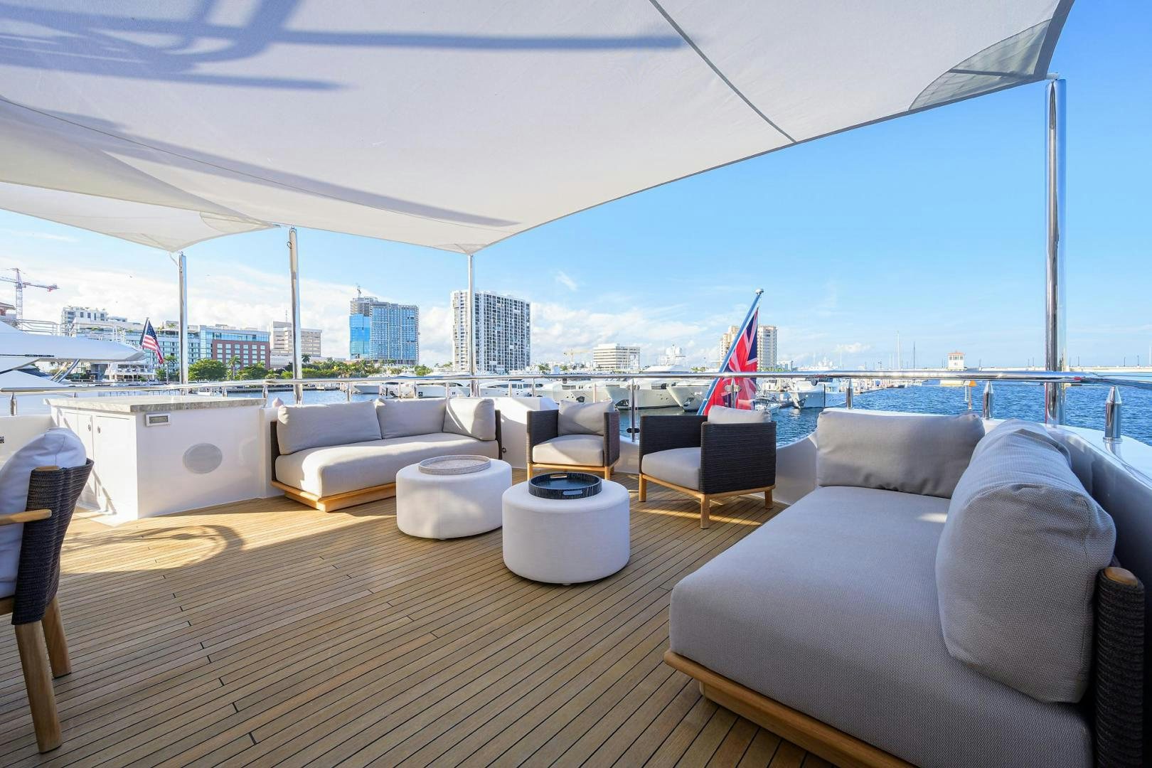 a large living room with a large window overlooking a city aboard SEANASH Yacht for Sale