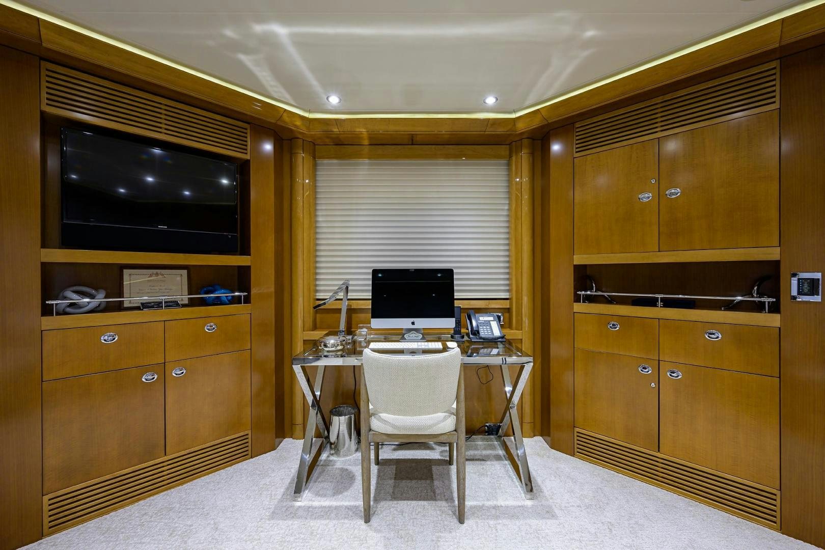 a room with a desk and a computer aboard SEANASH Yacht for Sale