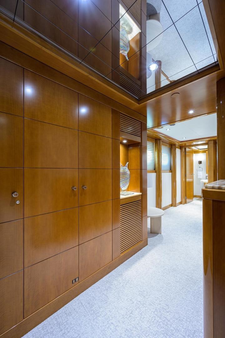 a room with wooden cabinets aboard SEANASH Yacht for Sale