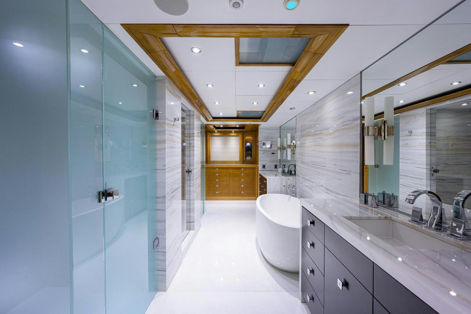a bathroom with a glass shower aboard SEANASH Yacht for Sale