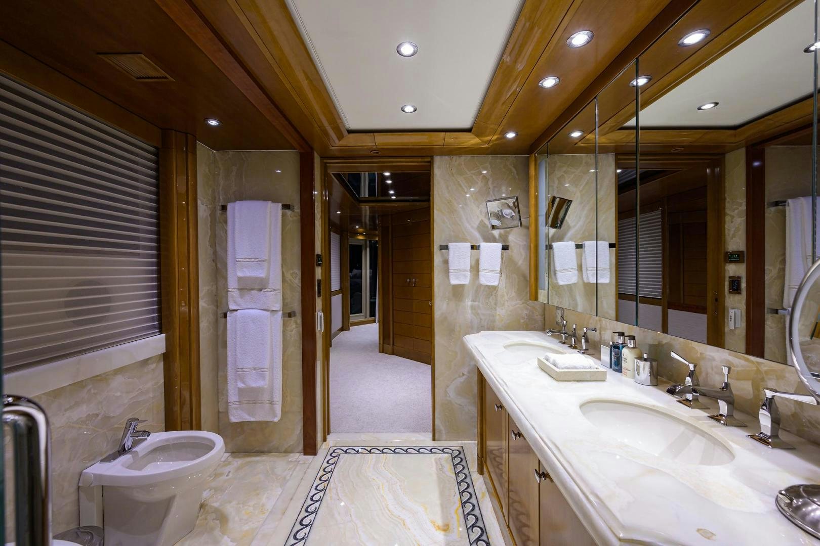 a bathroom with a large mirror aboard SEANASH Yacht for Sale