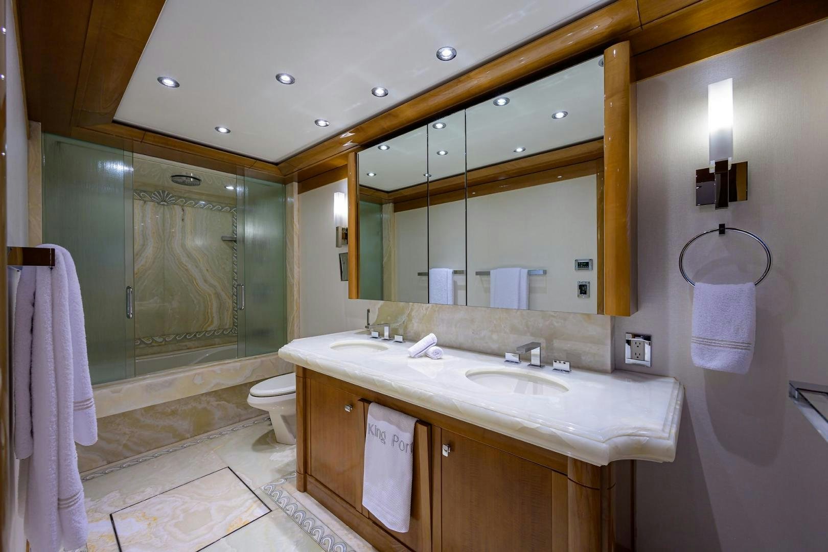 a bathroom with a large mirror aboard SEANASH Yacht for Sale
