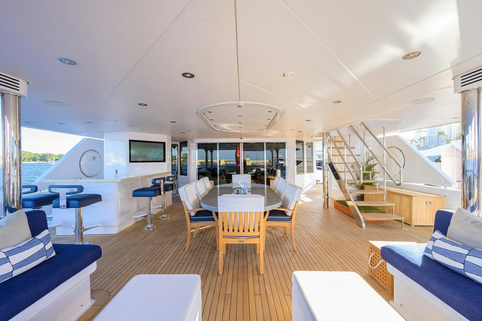 a room with a table chairs and a couch aboard SEANASH Yacht for Sale