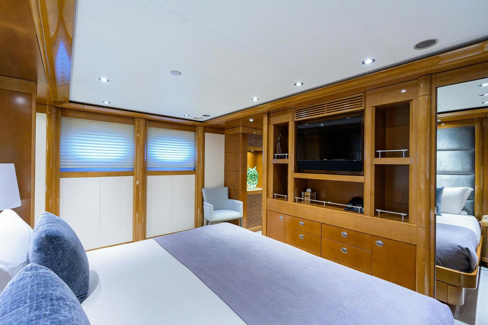 a room with a bed and a television aboard SEANASH Yacht for Sale