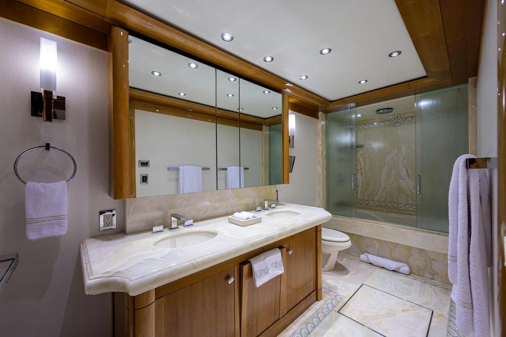 a bathroom with a large mirror aboard SEANASH Yacht for Sale